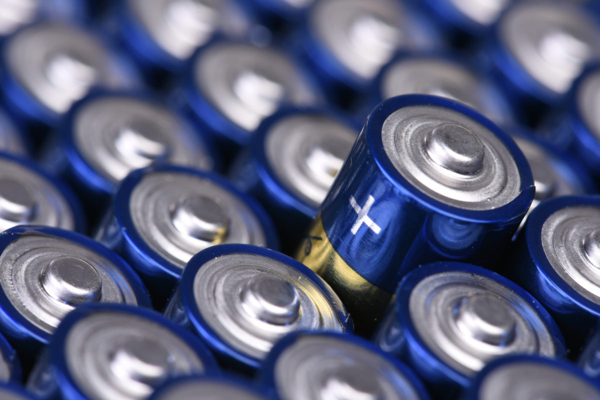 a close-up of dozens of small batteries 