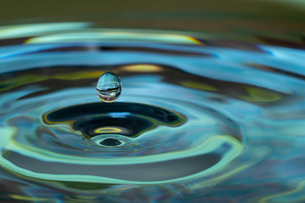 a close-up of a water droplet in mid-air