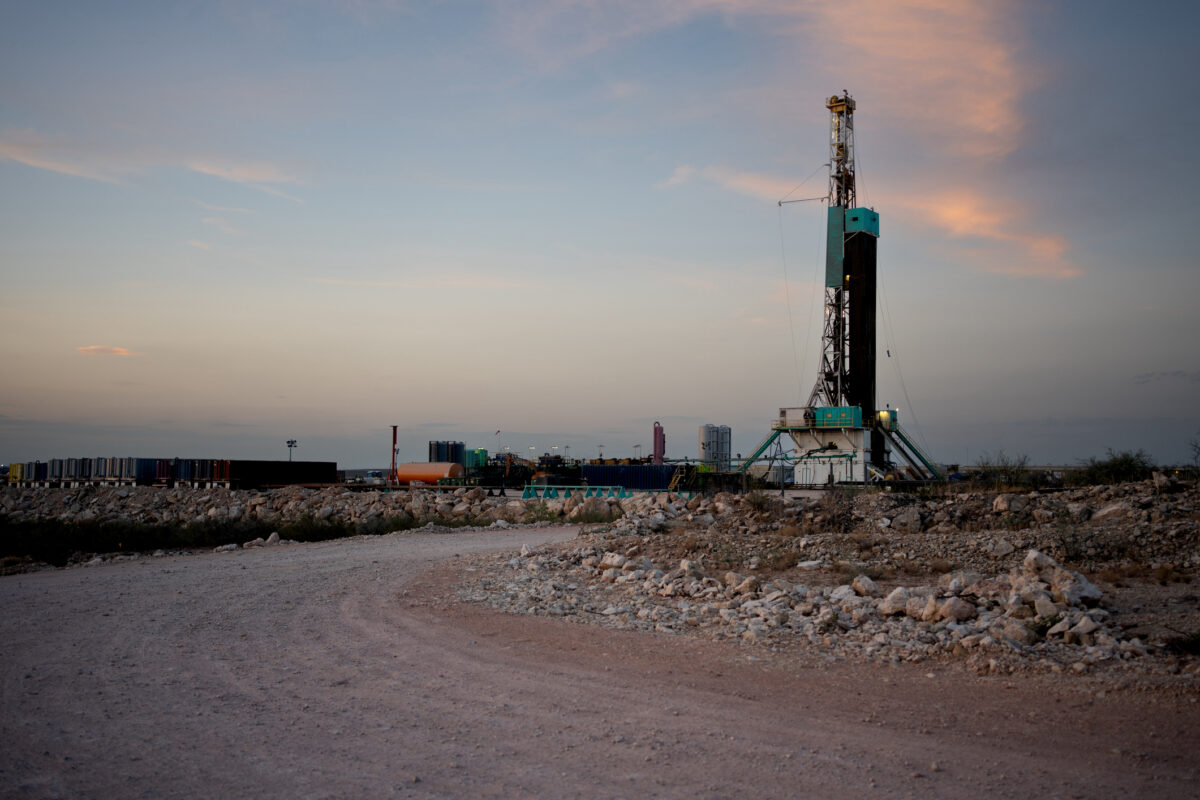 an oil rig on a dirt road
